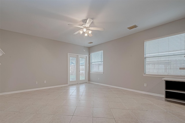 unfurnished room featuring french doors, ceiling fan, and light tile patterned floors