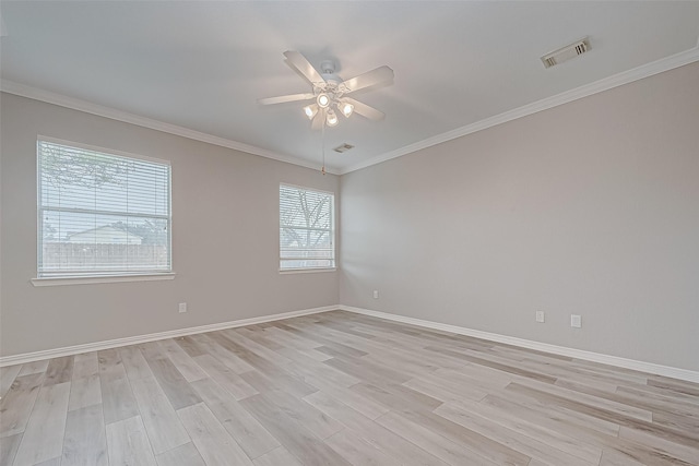 unfurnished room with ceiling fan, light hardwood / wood-style flooring, and crown molding