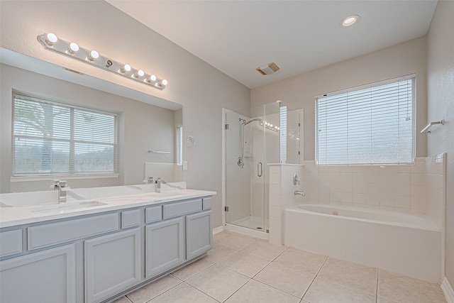 bathroom featuring separate shower and tub, tile patterned floors, and vanity