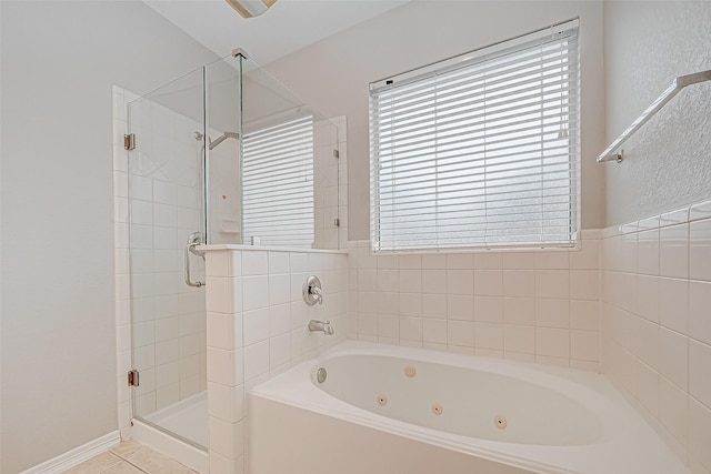 bathroom featuring independent shower and bath and tile patterned flooring