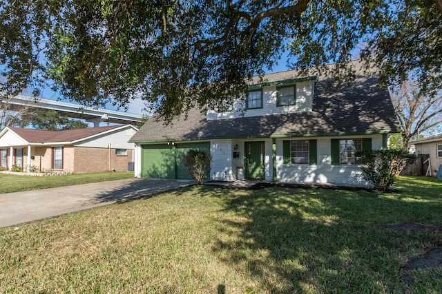 view of front facade with a garage and a front yard