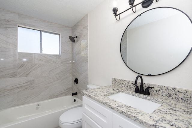 full bathroom with toilet, vanity, and tiled shower / bath combo