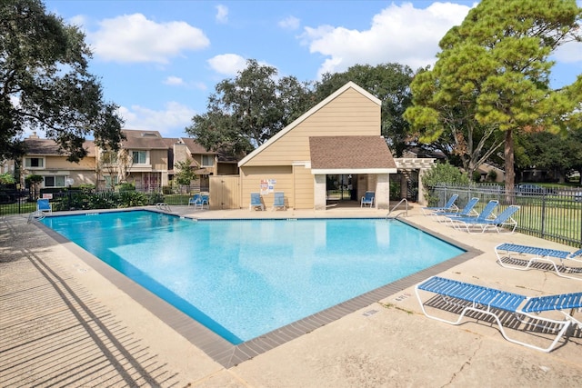 view of pool with a pergola and a patio area