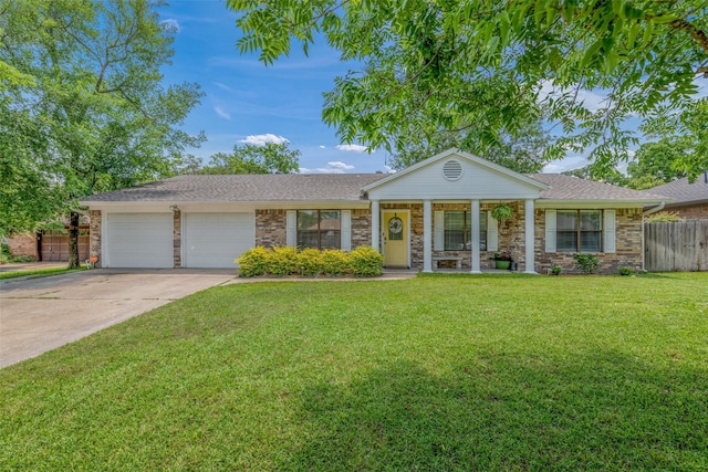 ranch-style home with a front lawn and a garage