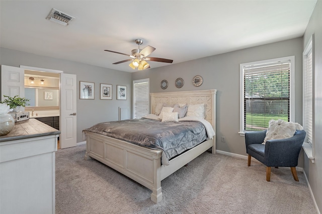 bedroom with light colored carpet and ceiling fan