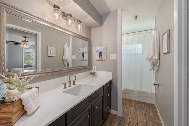 bathroom featuring vanity, ceiling fan, and shower / bath combo with shower curtain