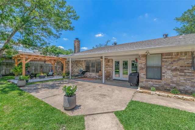 view of patio / terrace featuring french doors and a pergola