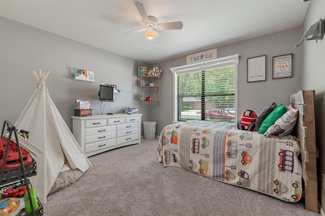 carpeted bedroom featuring ceiling fan