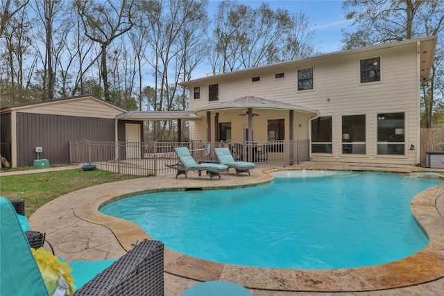 view of pool with a patio area and ceiling fan