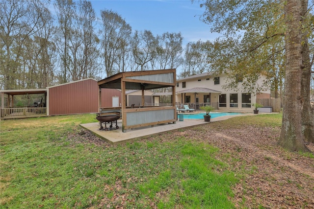 rear view of property with a bar and a yard