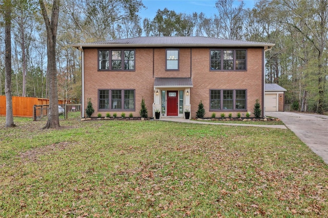 view of front facade with a garage and a front lawn