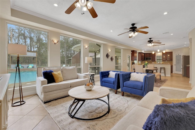 living room with ornamental molding and light tile patterned flooring