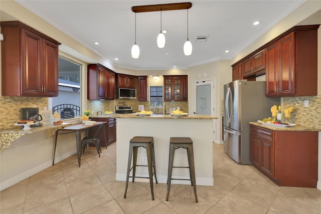 kitchen featuring decorative backsplash, light stone countertops, and appliances with stainless steel finishes