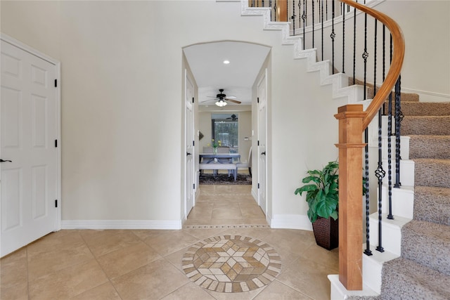 entryway with ceiling fan and light tile patterned floors