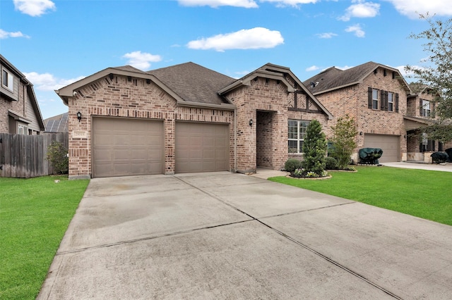 view of front of property with a garage and a front yard