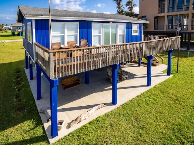 view of property's community with a yard, a patio area, and a deck