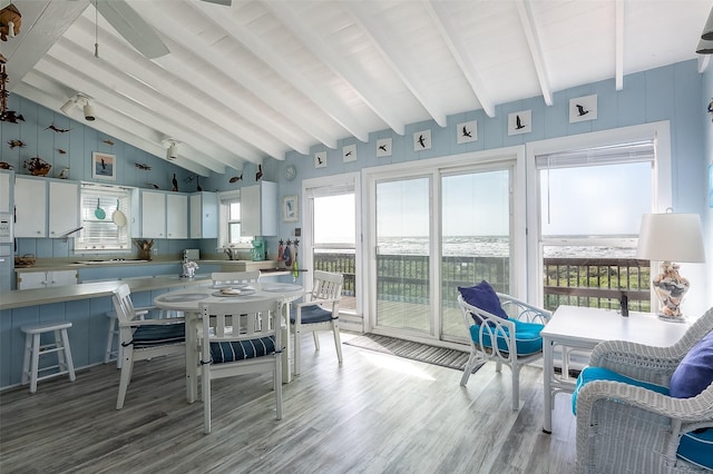 sunroom with lofted ceiling with beams