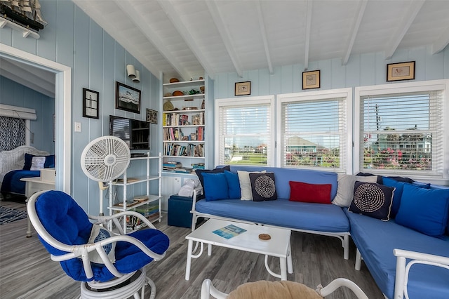 sunroom featuring beam ceiling