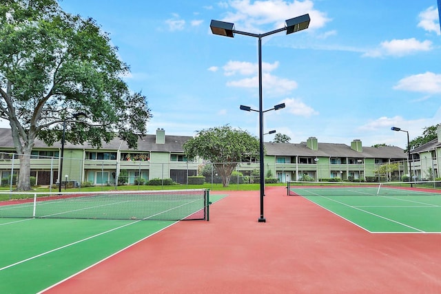 view of sport court featuring basketball hoop