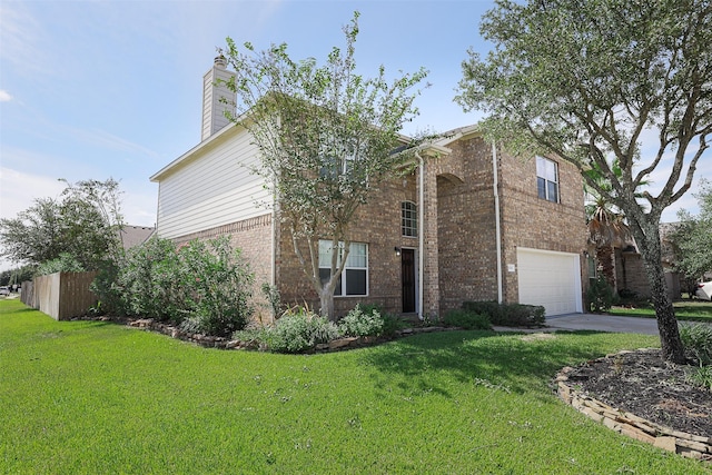 view of front of house with a garage and a front lawn