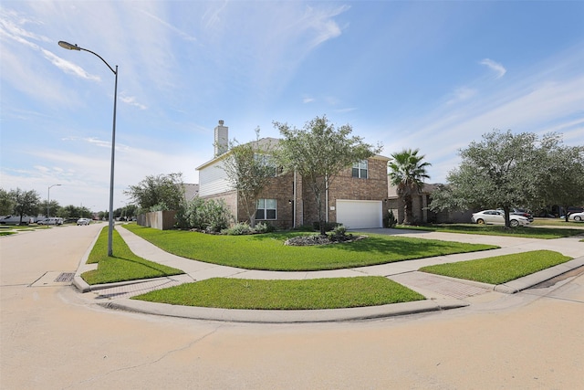 view of front facade featuring a garage and a front yard