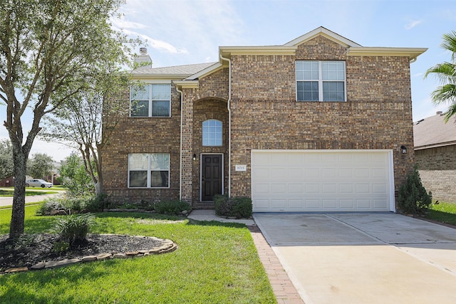 view of front of property with a garage and a front lawn