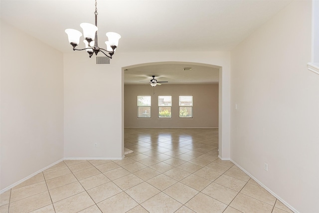 spare room with light tile patterned floors and ceiling fan with notable chandelier