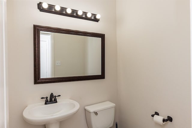 bathroom with sink and toilet