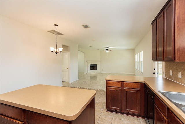 kitchen with decorative backsplash, ceiling fan with notable chandelier, dishwasher, and light tile patterned flooring