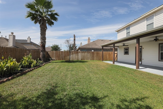 view of yard with a patio and ceiling fan