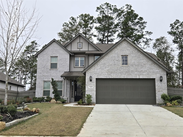 view of front facade featuring a front yard and a garage