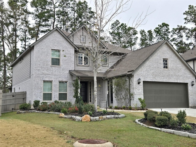 view of front of house featuring a front yard and a garage