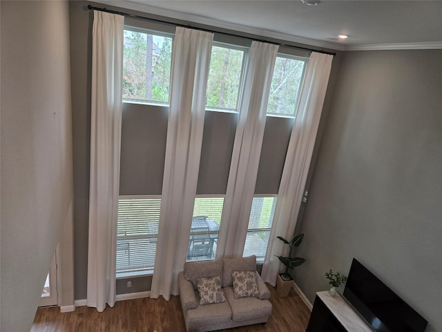 interior space with crown molding and wood-type flooring