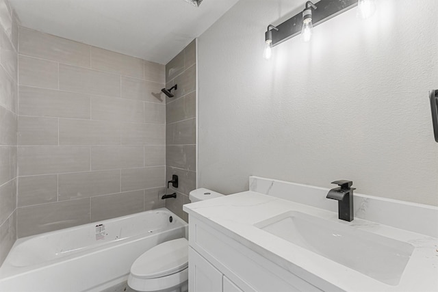 full bathroom featuring toilet, vanity, and tiled shower / bath