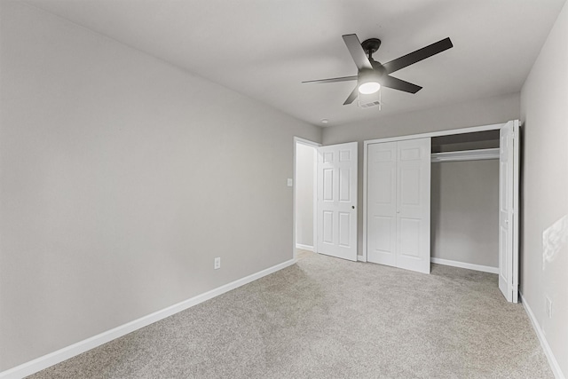 unfurnished bedroom with carpet flooring, a closet, and ceiling fan