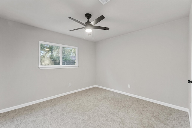 spare room with ceiling fan and carpet flooring