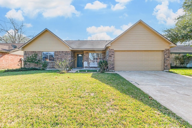 single story home with a garage and a front lawn