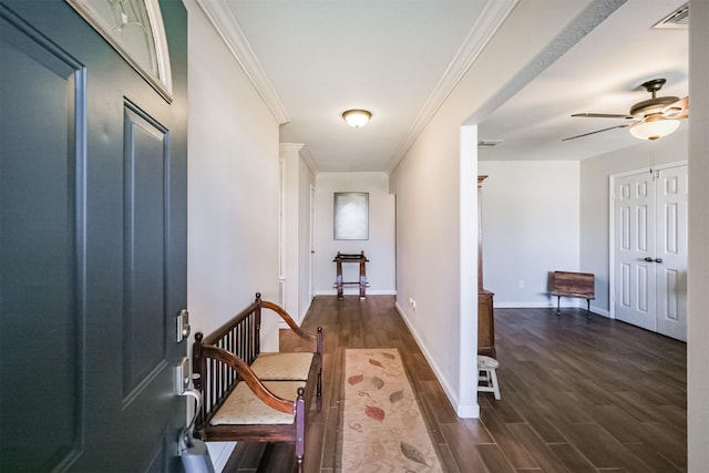 hallway featuring crown molding and dark hardwood / wood-style floors