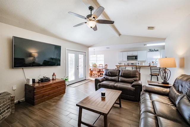 living room featuring french doors, lofted ceiling with beams, and ceiling fan