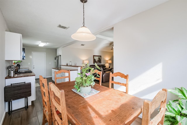 dining area featuring ceiling fan and sink