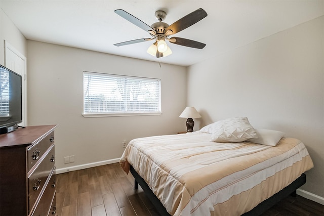 bedroom with ceiling fan and dark hardwood / wood-style flooring