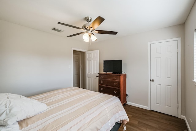 bedroom featuring ceiling fan and dark wood-type flooring