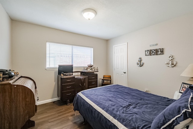 bedroom featuring wood-type flooring