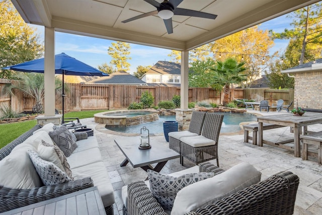 view of patio featuring ceiling fan, a swimming pool with hot tub, and an outdoor living space