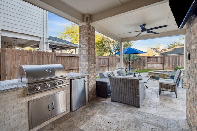 view of patio with an outdoor hangout area, ceiling fan, and area for grilling