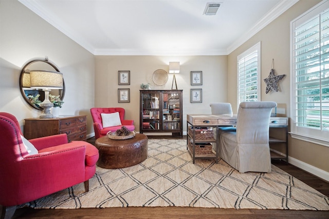 office with ornamental molding, plenty of natural light, and light hardwood / wood-style flooring