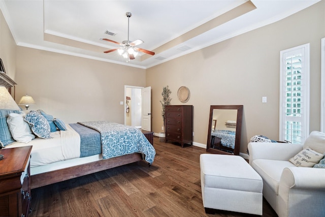 bedroom featuring crown molding, ceiling fan, a tray ceiling, and hardwood / wood-style floors