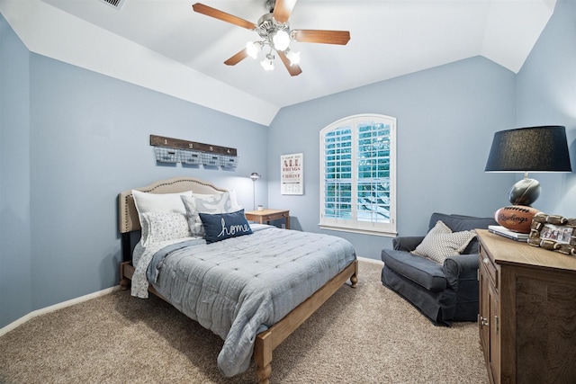 bedroom featuring ceiling fan, vaulted ceiling, and light carpet