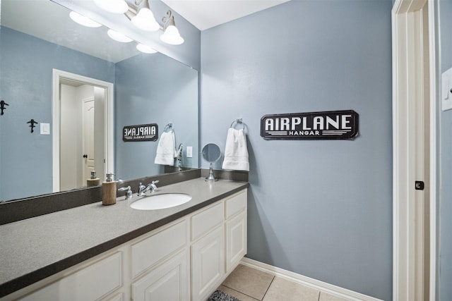 bathroom featuring tile patterned flooring and vanity