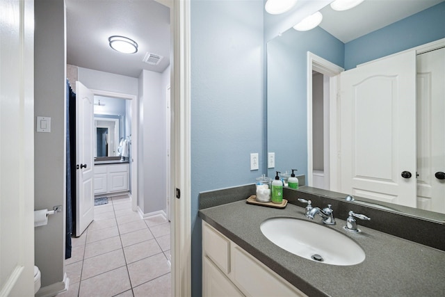 bathroom with vanity and tile patterned floors